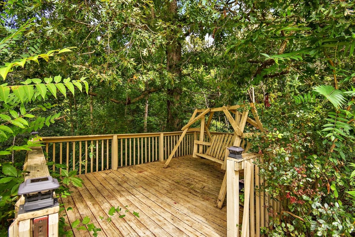 1510 Penile Hill Road Decherd, TN 37324 - Photo 30 of 34 a view of balcony with wooden floor and fence