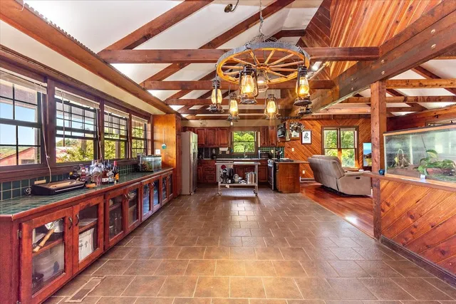 a kitchen with stainless steel appliances granite countertop a sink and a counter space