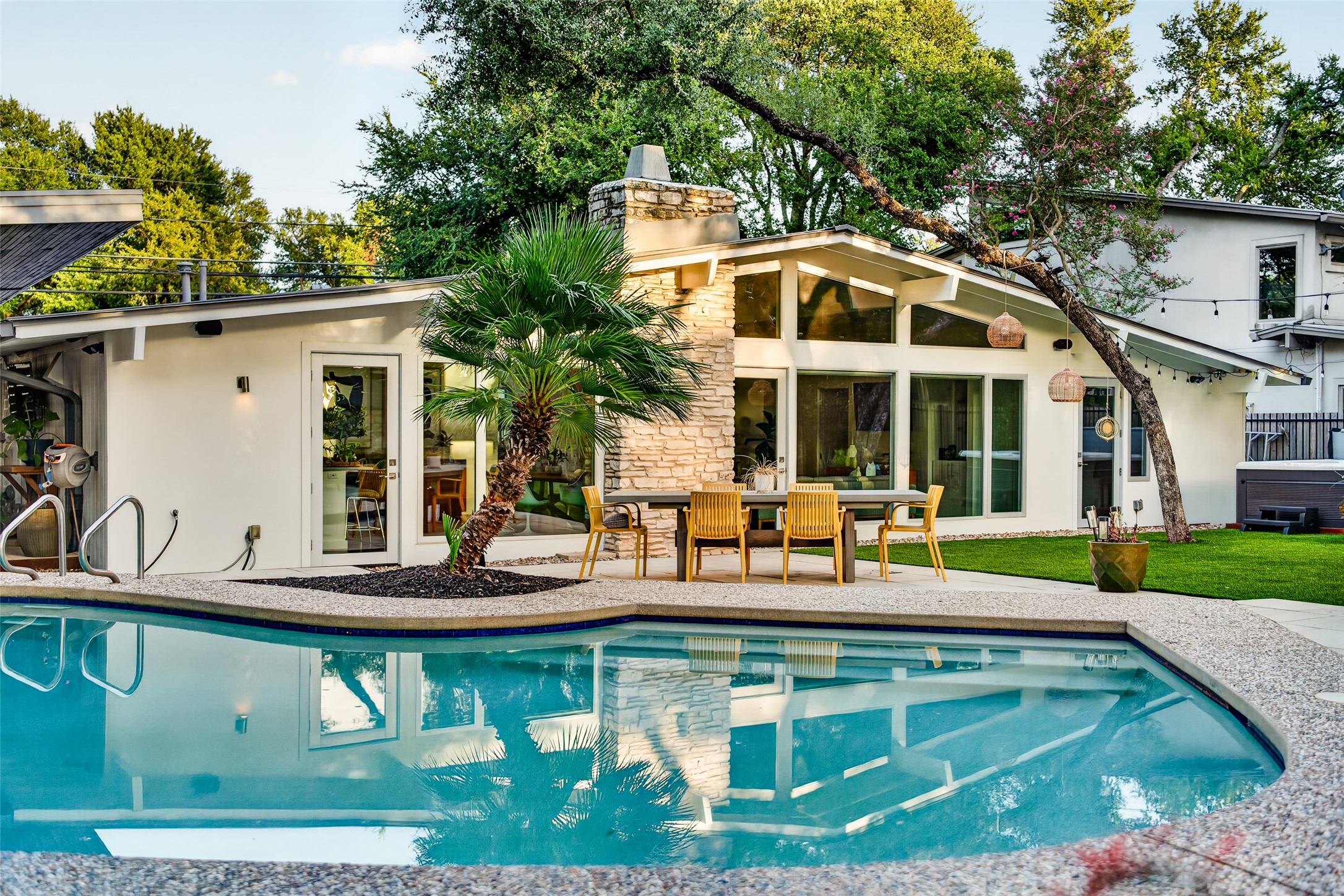 412 Ridgewood Road West Lake Hills, TX 78746 - Photo 23 of 40 An inviting backyard oasis features a shimmering pool, ample patio space for entertaining.