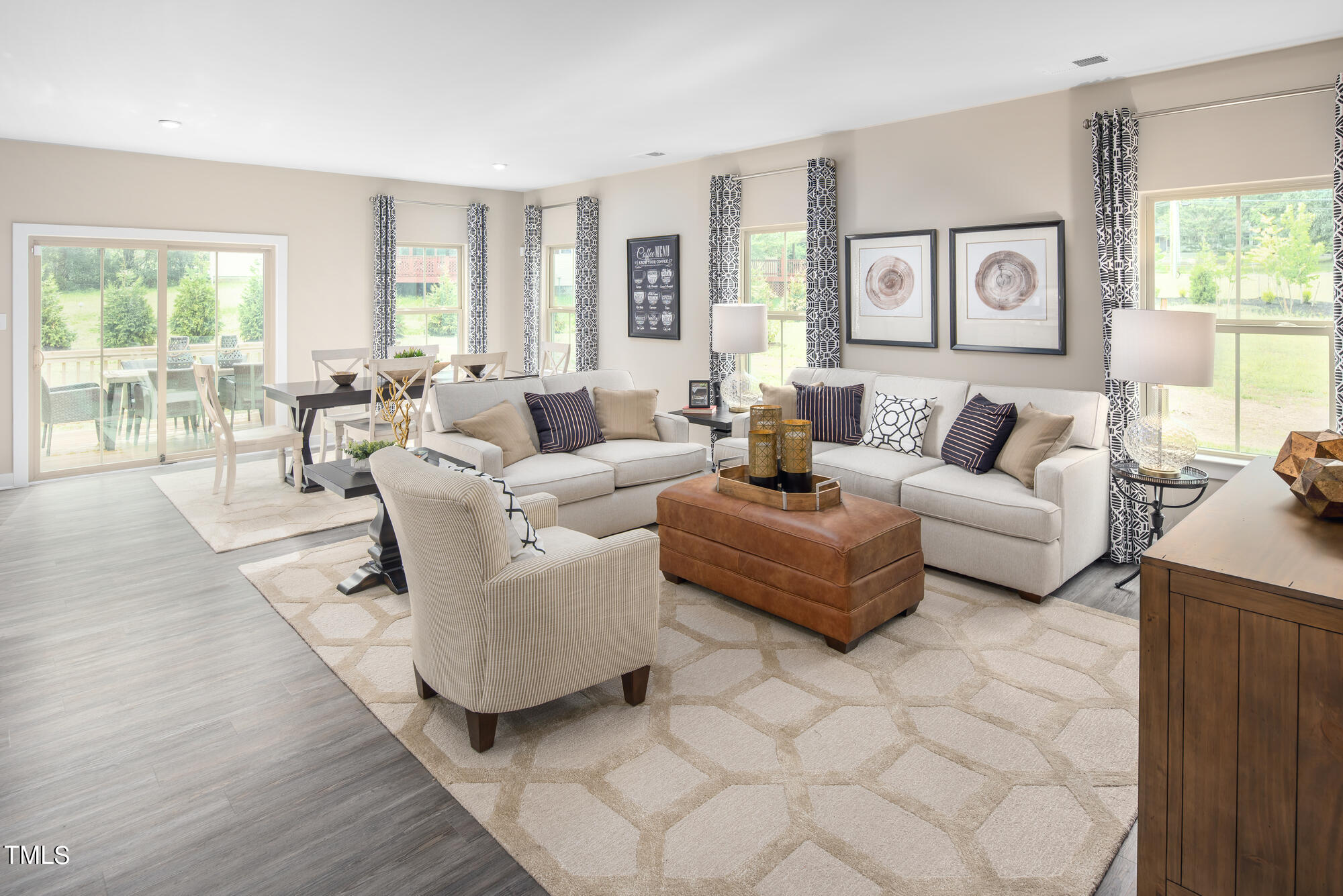 8909 Stratus Street Willow Spring, NC 27592 - Photo 11 of 30 a living room with furniture and a large window