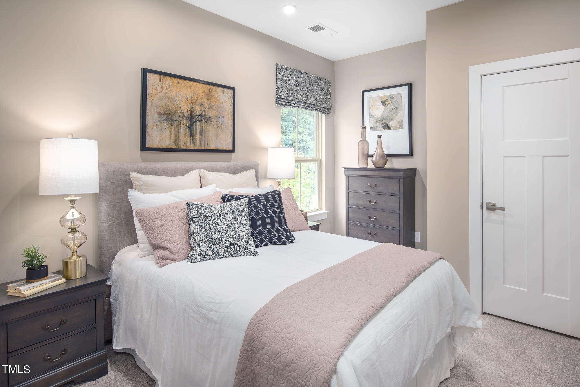8909 Stratus Street Willow Spring, NC 27592 - Photo 14 of 30 a bedroom with a bed and a lamp on dresser