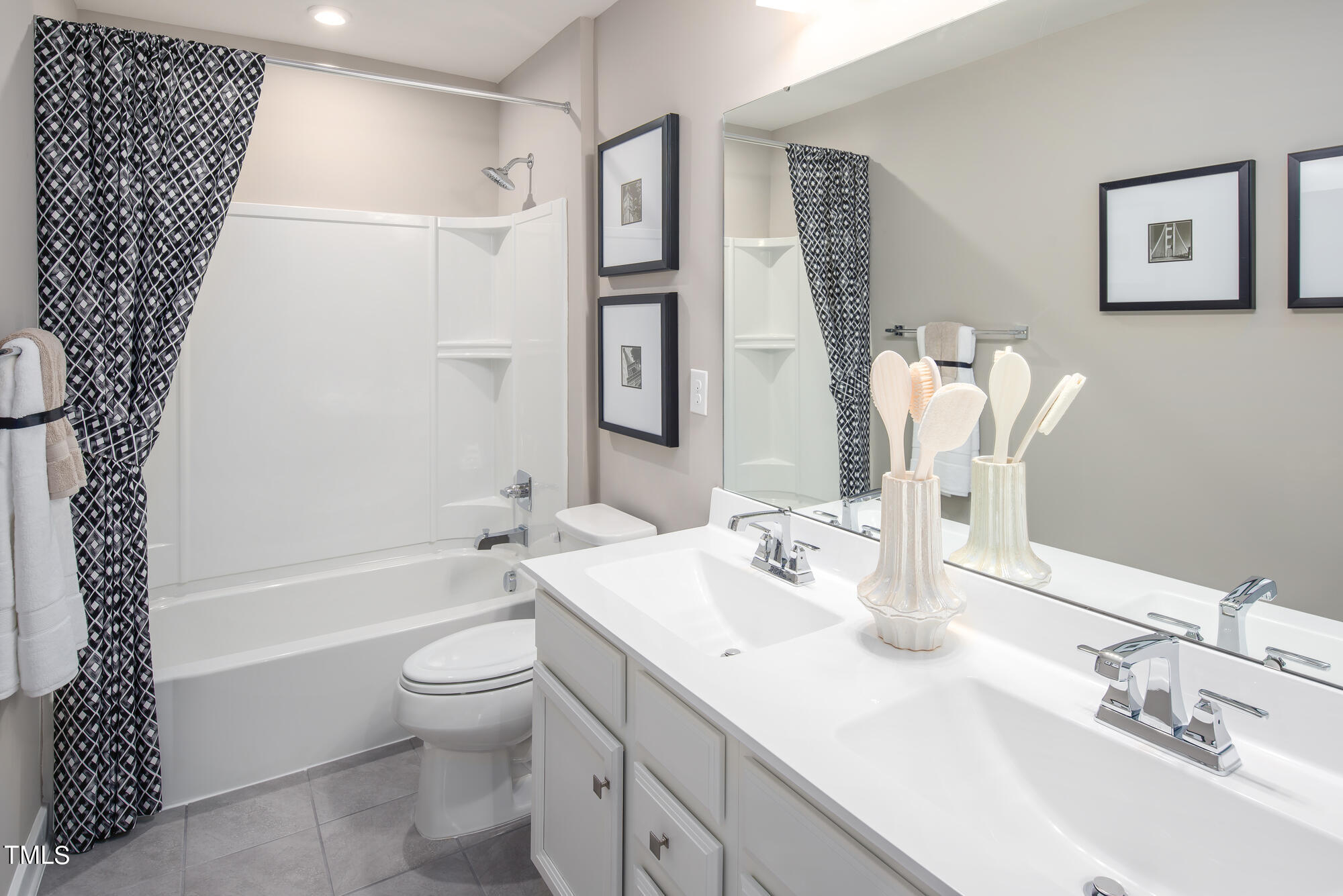 8909 Stratus Street Willow Spring, NC 27592 - Photo 24 of 30 a bathroom with a sink a toilet and shower