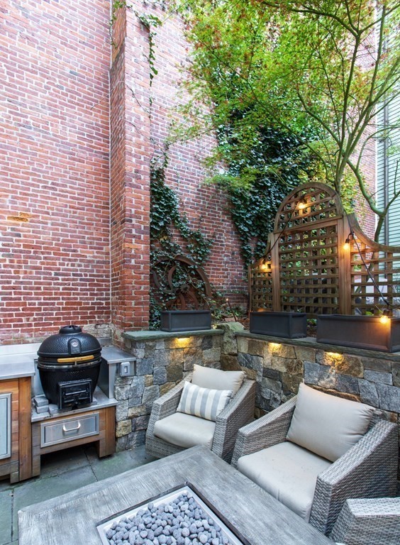40 Joy Street, Unit 2 Boston, MA 02114 - Photo 12 of 13 a view of patio with couches and a fire pit