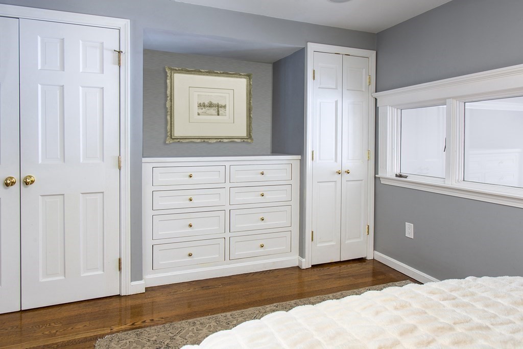 40 Joy Street, Unit 2 Boston, MA 02114 - Photo 6 of 13 a view of a bedroom with wooden floor and cabinet