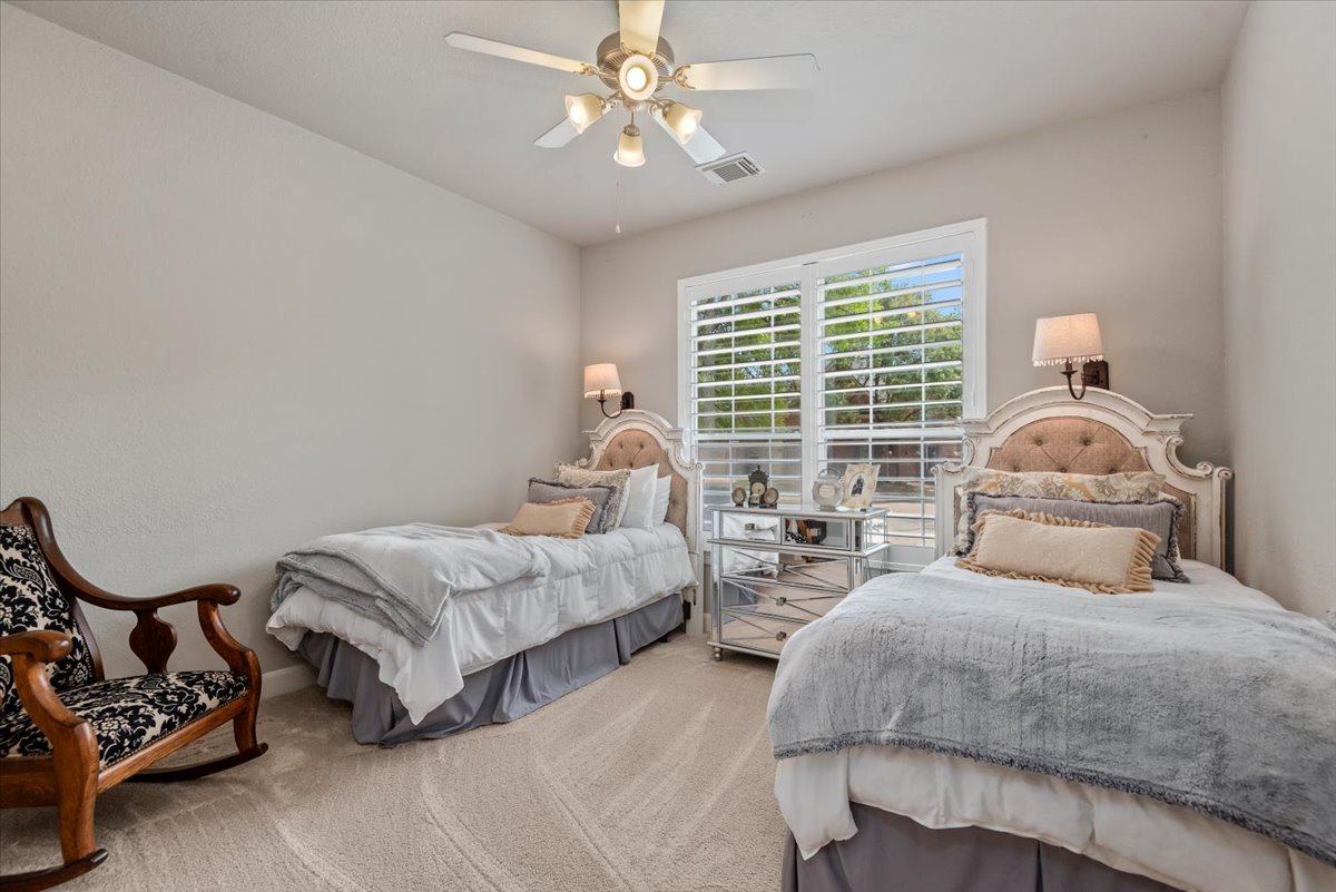 15519 Stallion Point Circle Cypress, TX 77429 - Photo 19 of 37 This room features light-colored walls, carpeted flooring, and a ceiling fan