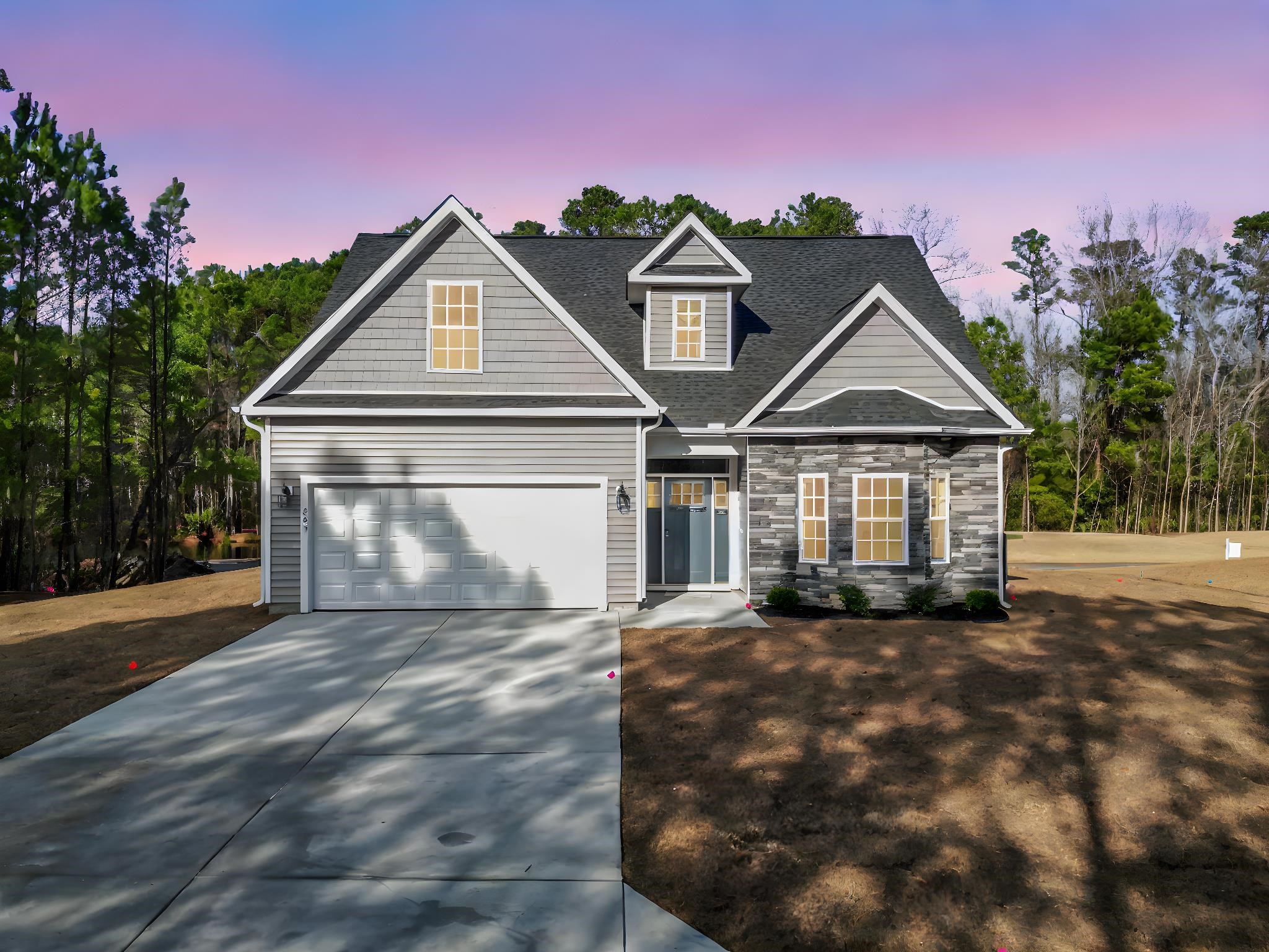 View of front of property featuring driveway, a garage, a shingled roof, and stone siding
