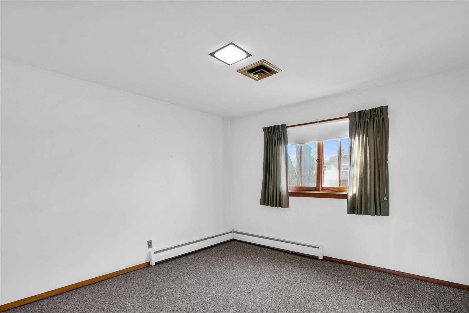 2406 John Drive Urbana, IL 61802 - Photo 14 of 28 an empty room with a window