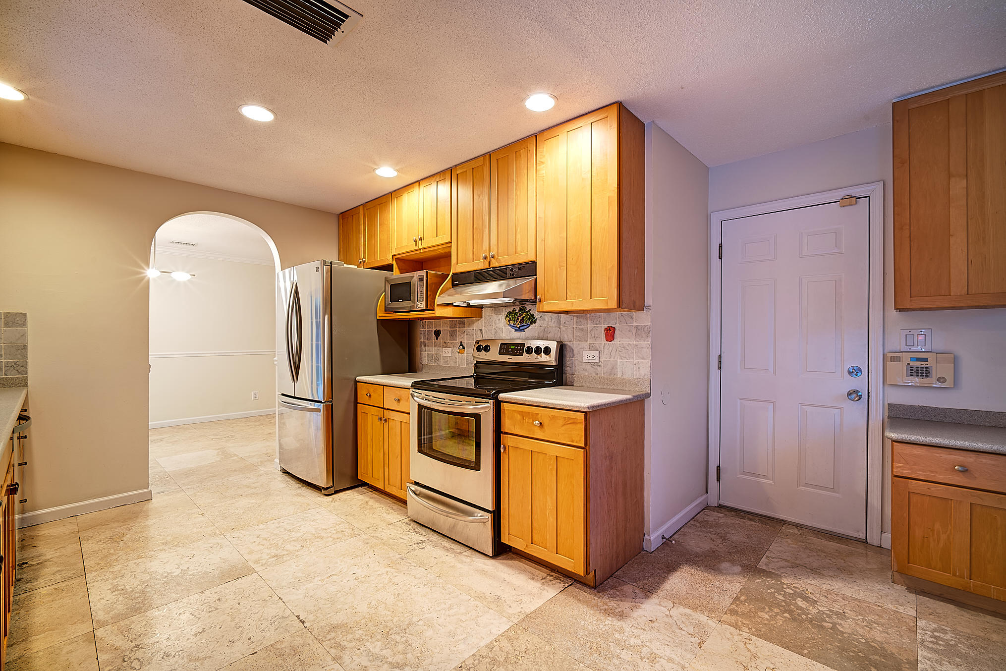 1120 Southwest 20th Street Boca Raton, FL 33486 - Photo 13 of 53 a kitchen with stainless steel appliances granite countertop a stove a sink and a refrigerator