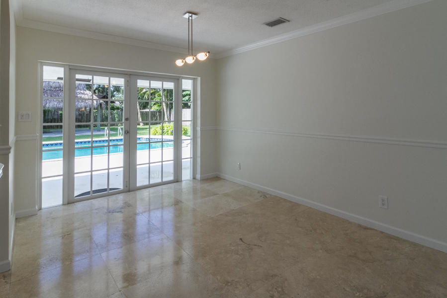 1120 Southwest 20th Street Boca Raton, FL 33486 - Photo 19 of 53 a view of an empty room with windows