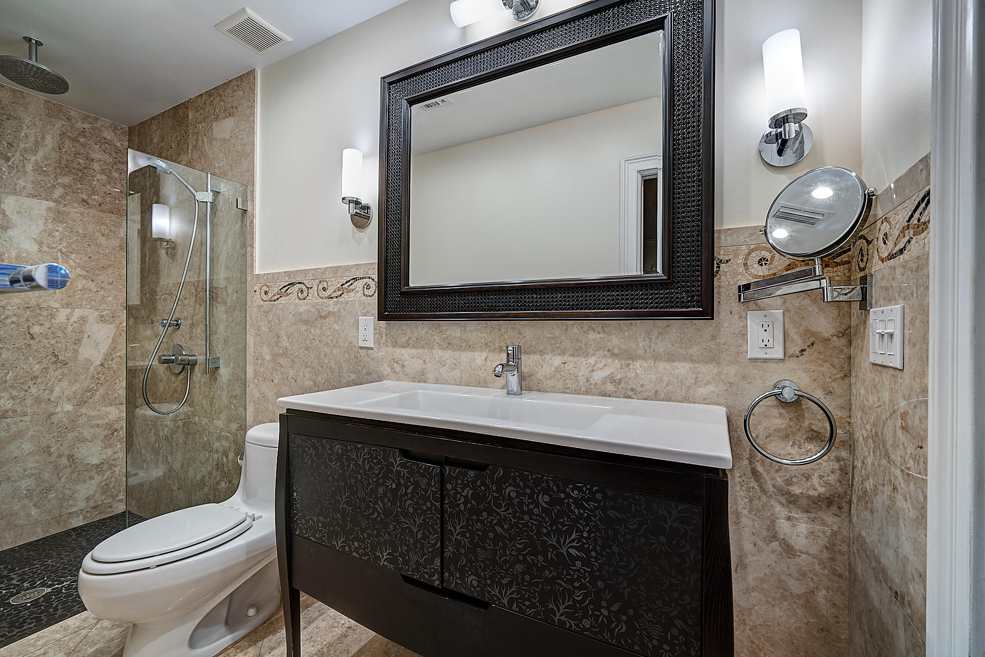 1120 Southwest 20th Street Boca Raton, FL 33486 - Photo 23 of 53 a bathroom with a toilet sink vanity granite and mirror