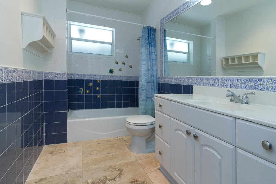 1120 Southwest 20th Street Boca Raton, FL 33486 - Photo 24 of 53 a bathroom with a sink a toilet and bathtub