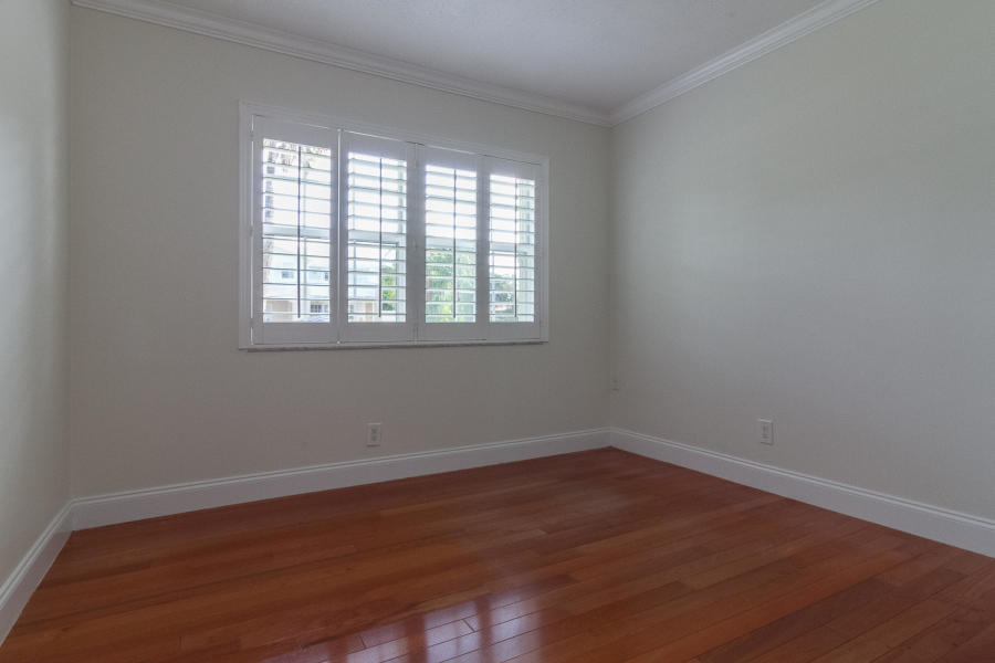 1120 Southwest 20th Street Boca Raton, FL 33486 - Photo 27 of 53 wooden floor and window in an empty room