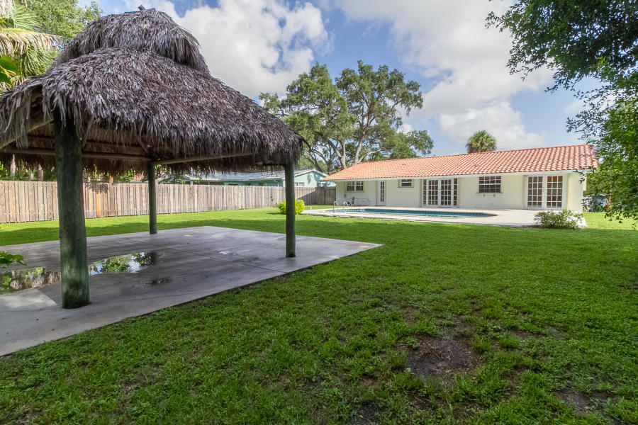 1120 Southwest 20th Street Boca Raton, FL 33486 - Photo 33 of 53 a view of a house with a yard and sitting area