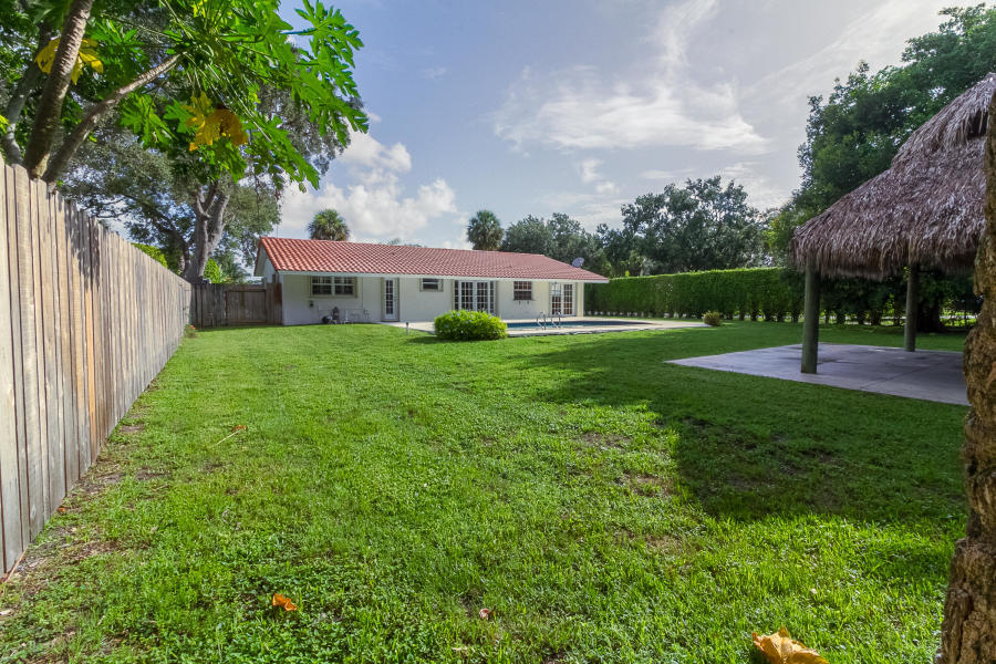 1120 Southwest 20th Street Boca Raton, FL 33486 - Photo 34 of 53 a view of a house with a backyard