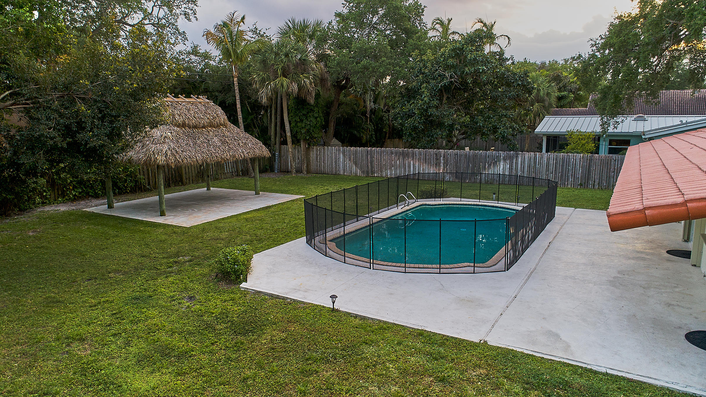 1120 Southwest 20th Street Boca Raton, FL 33486 - Photo 43 of 53 a view of a swimming pool with a patio
