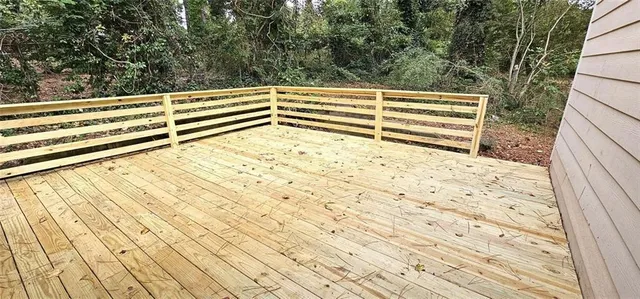 a view of wooden floor and fence