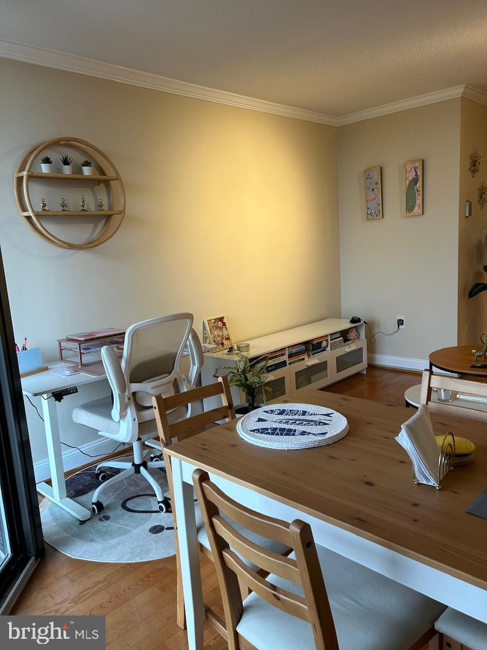 4242 East-West Highway, Unit 708 Chevy Chase, MD 20815 - Photo 5 of 12 a table and chairs in a room