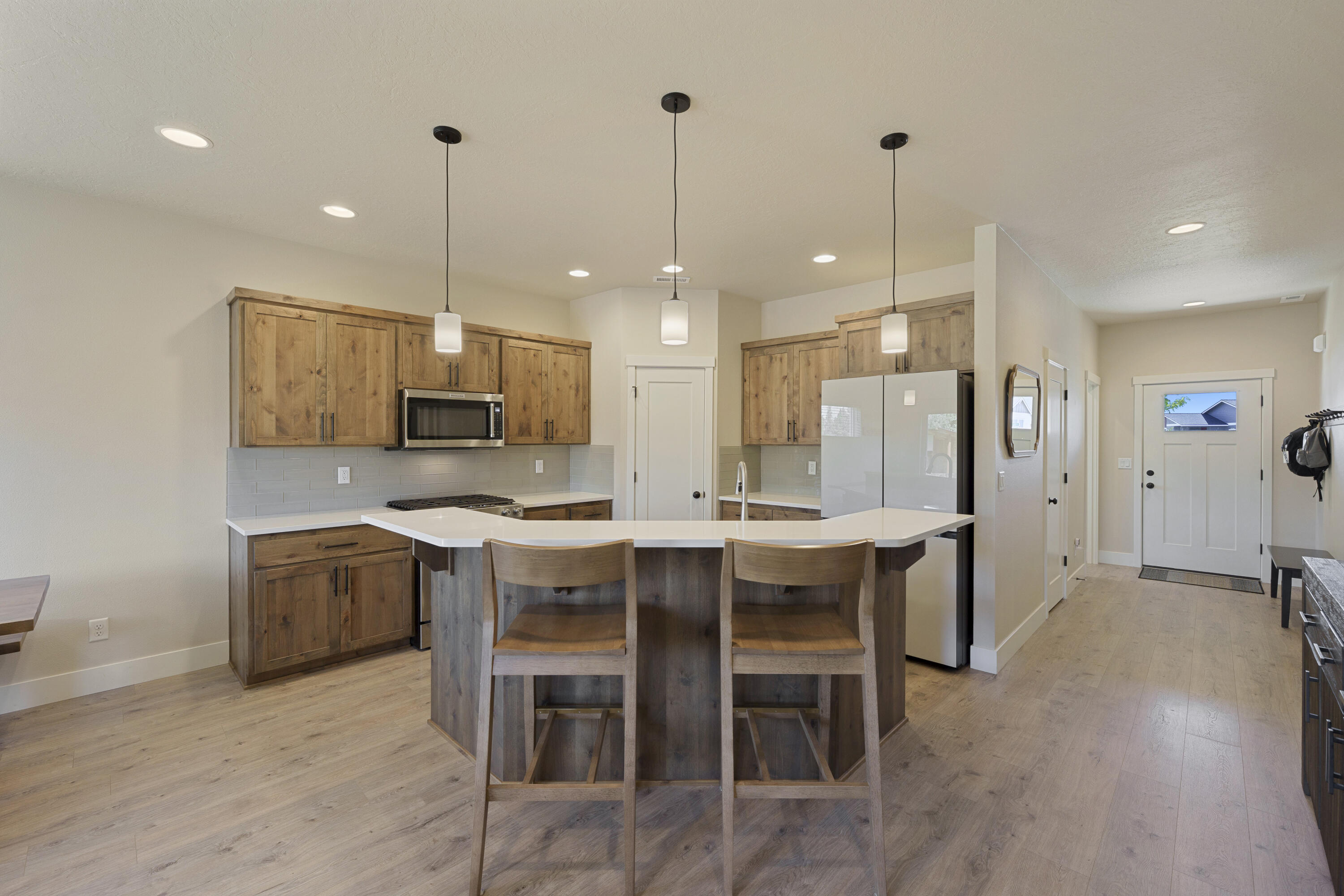 4999 Southwest Yew Place Redmond, OR 97756 - Photo 10 of 50 a large kitchen with a table and chairs