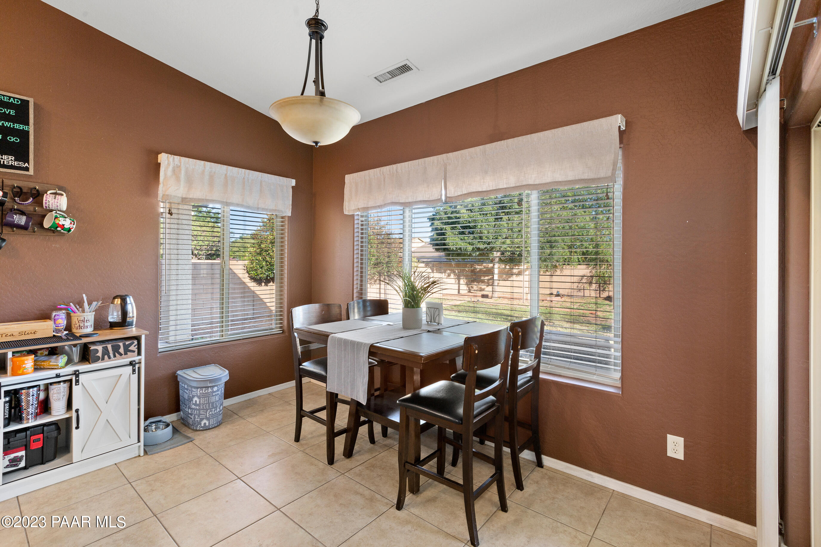 6622 Farmstead Road Prescott Valley, AZ 86314 - Photo 11 of 14 a view of a dining room with furniture window and outside view
