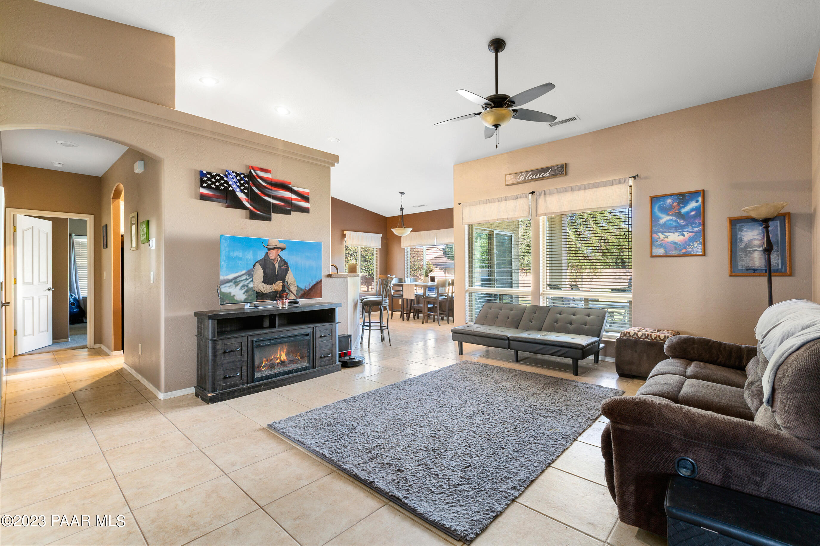 6622 Farmstead Road Prescott Valley, AZ 86314 - Photo 5 of 14 a living room with furniture and a fireplace