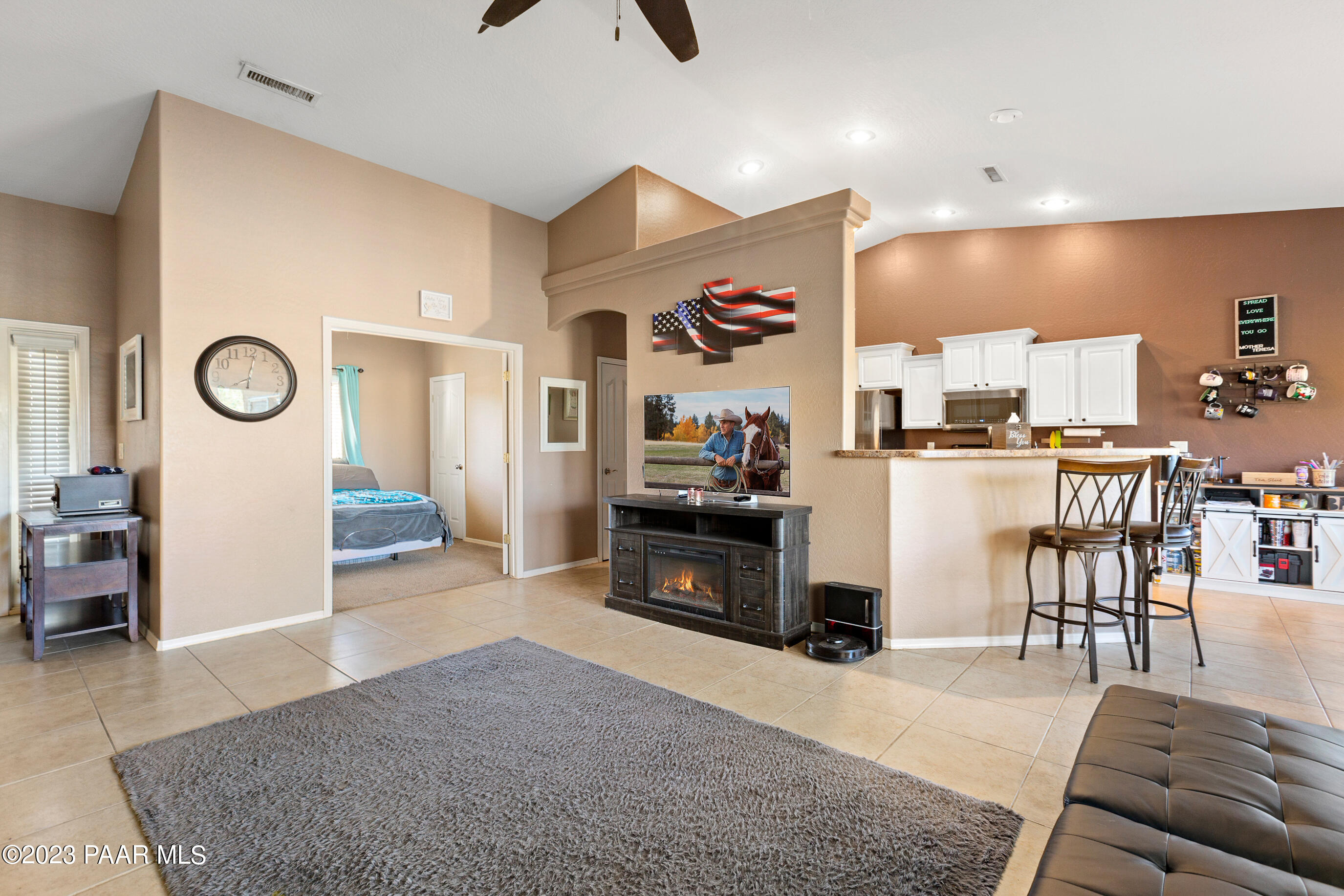 6622 Farmstead Road Prescott Valley, AZ 86314 - Photo 8 of 14 a living room with furniture and a wooden floor