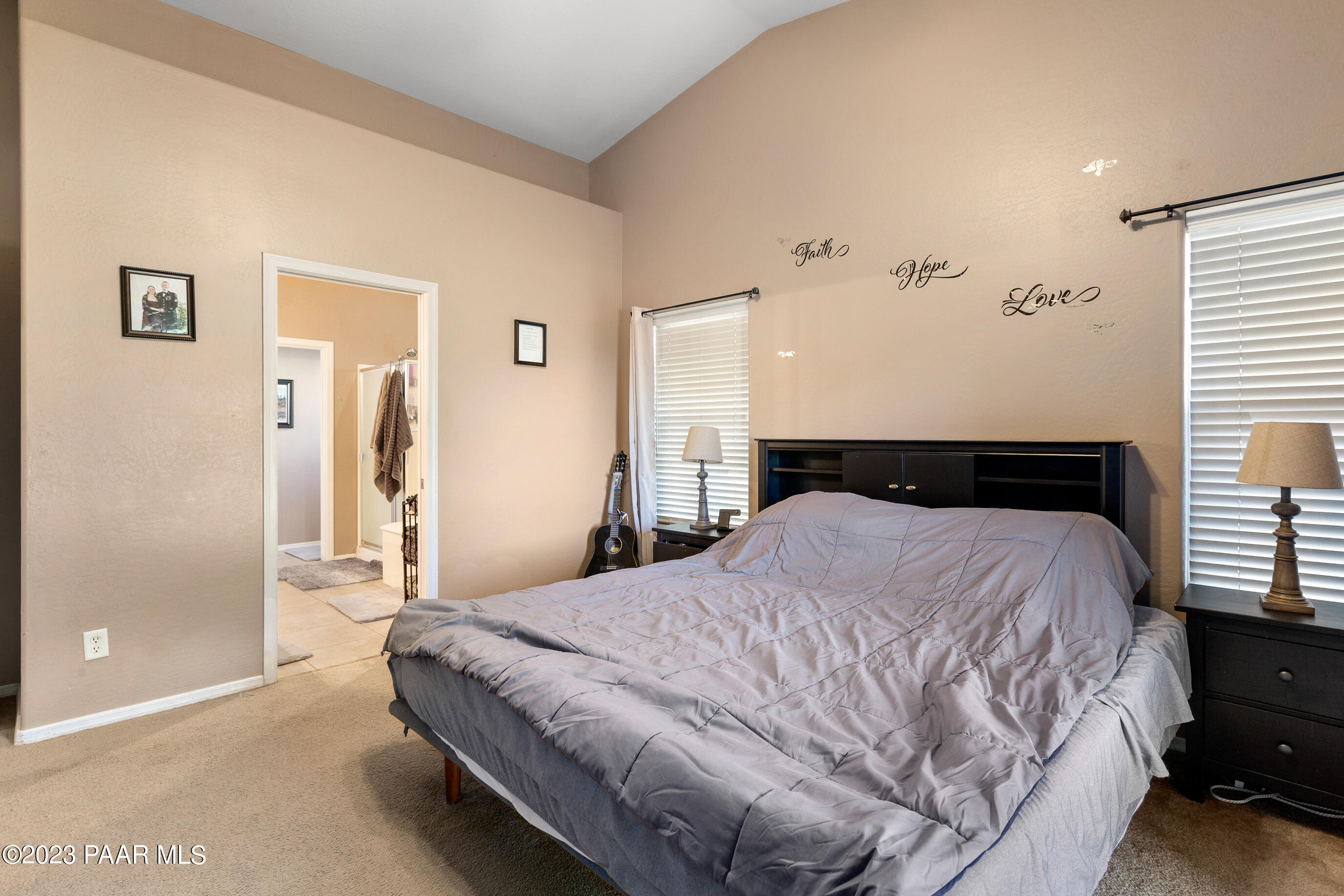 6622 Farmstead Road Prescott Valley, AZ 86314 - Photo 9 of 14 a bedroom with a bed and a cabinets