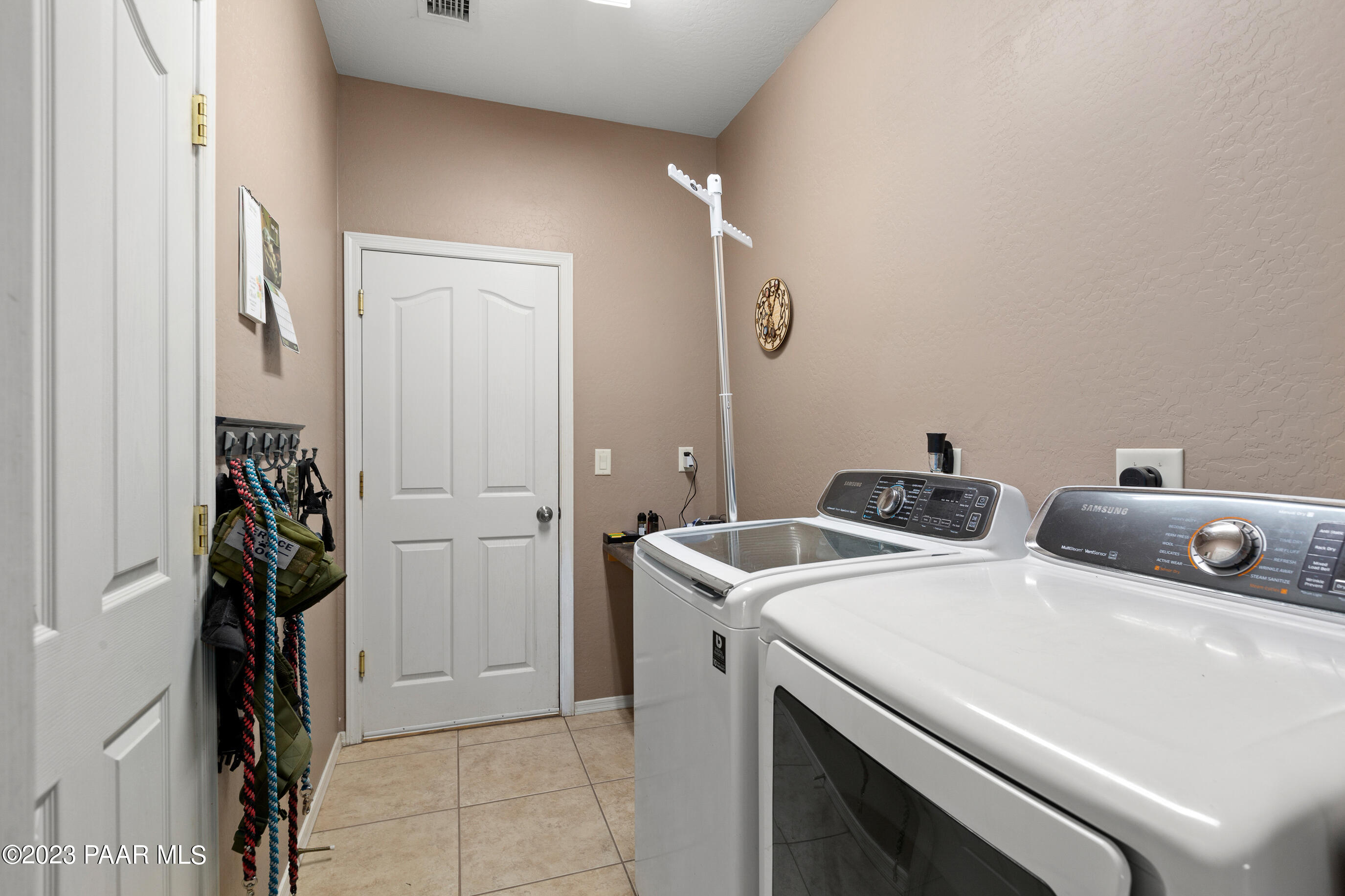 6622 Farmstead Road Prescott Valley, AZ 86314 - Photo 10 of 14 a utility room with dryer and washer