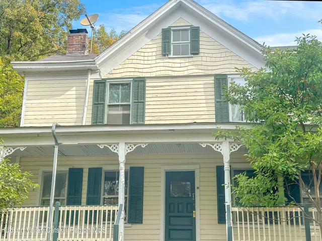 a front view of a house with a porch