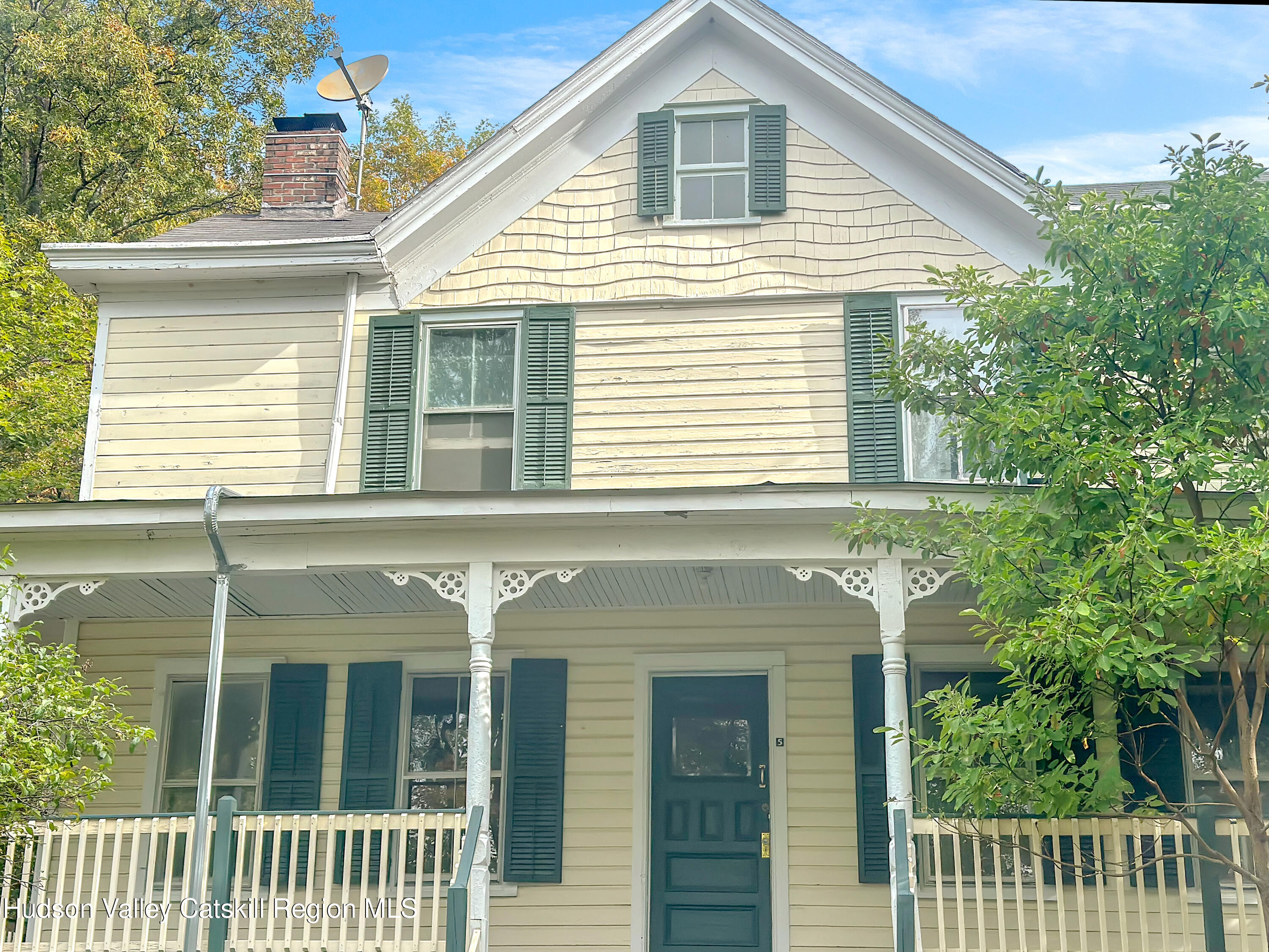 72 Meads Mountain Road, Unit 5 Woodstock, NY 12498 - Photo 2 of 20 a front view of a house with a porch
