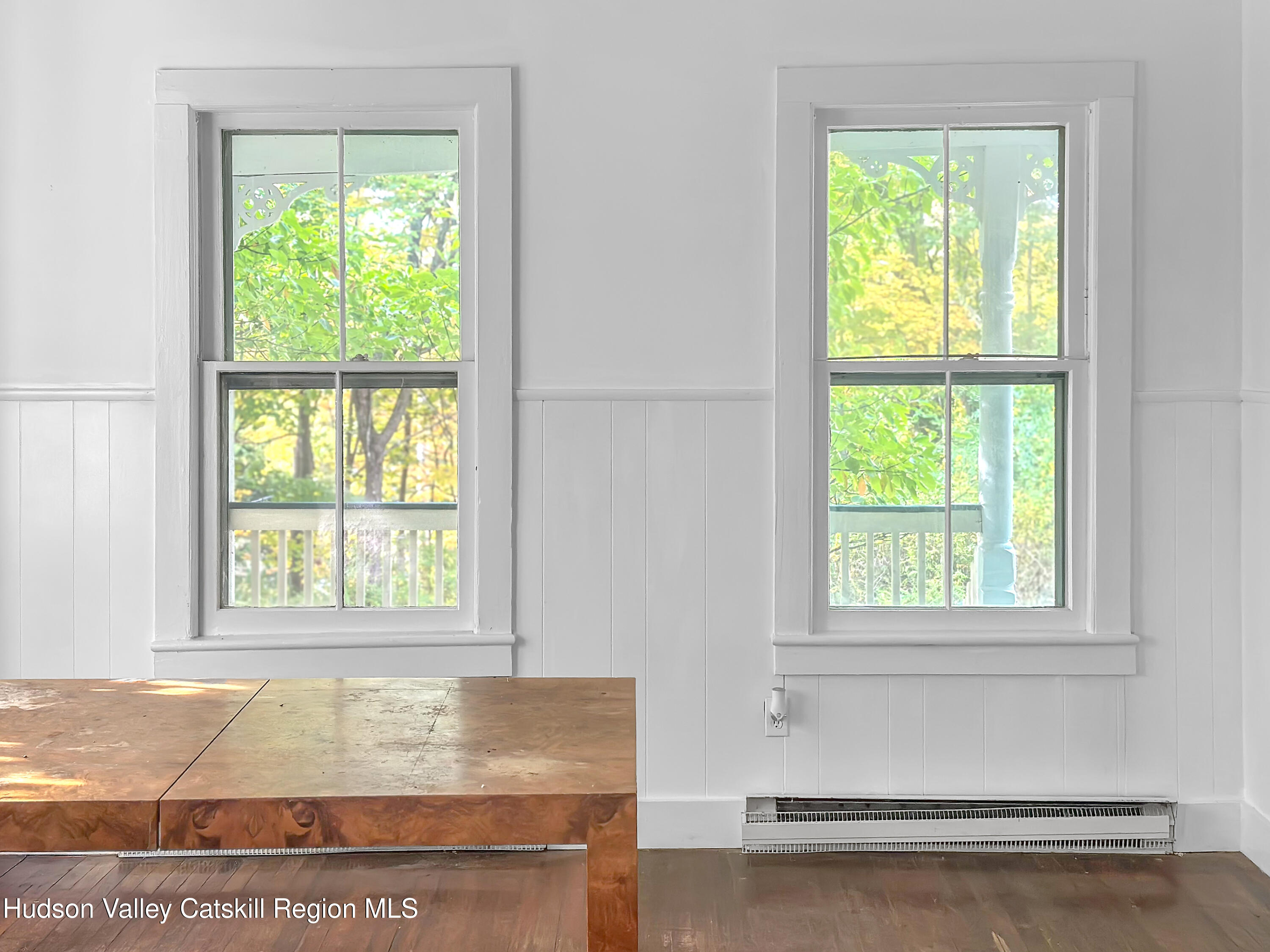 72 Meads Mountain Road, Unit 5 Woodstock, NY 12498 - Photo 8 of 20 a view of an empty room with wooden floor and a window