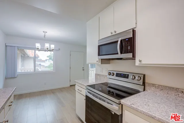 a kitchen with a stove and a microwave
