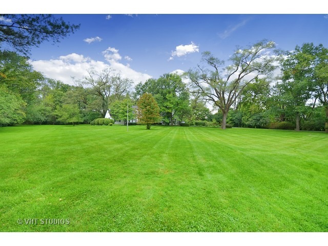 220 Dickens Road Northfield, IL 60093 - Photo 1 of 17 a view of a green yard