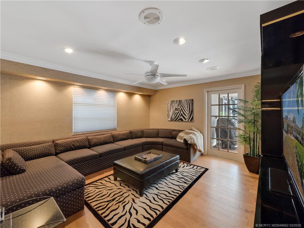 853 Northwest Spruce Ridge Drive Stuart, FL 34994 - Photo 13 of 20 a living room with furniture and a flat screen tv