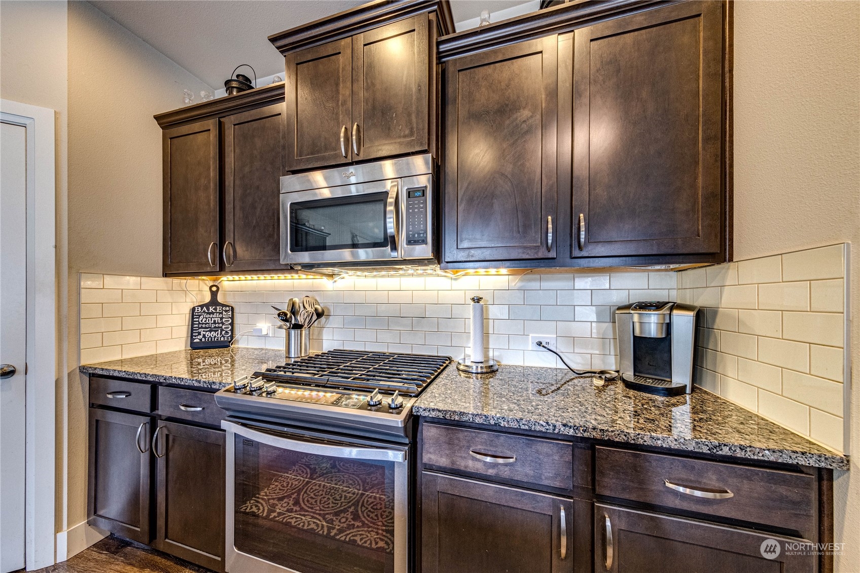 222 202nd Street Southeast Bothell, WA 98012 - Photo 11 of 37 a kitchen with granite countertop stainless steel appliances and cabinets