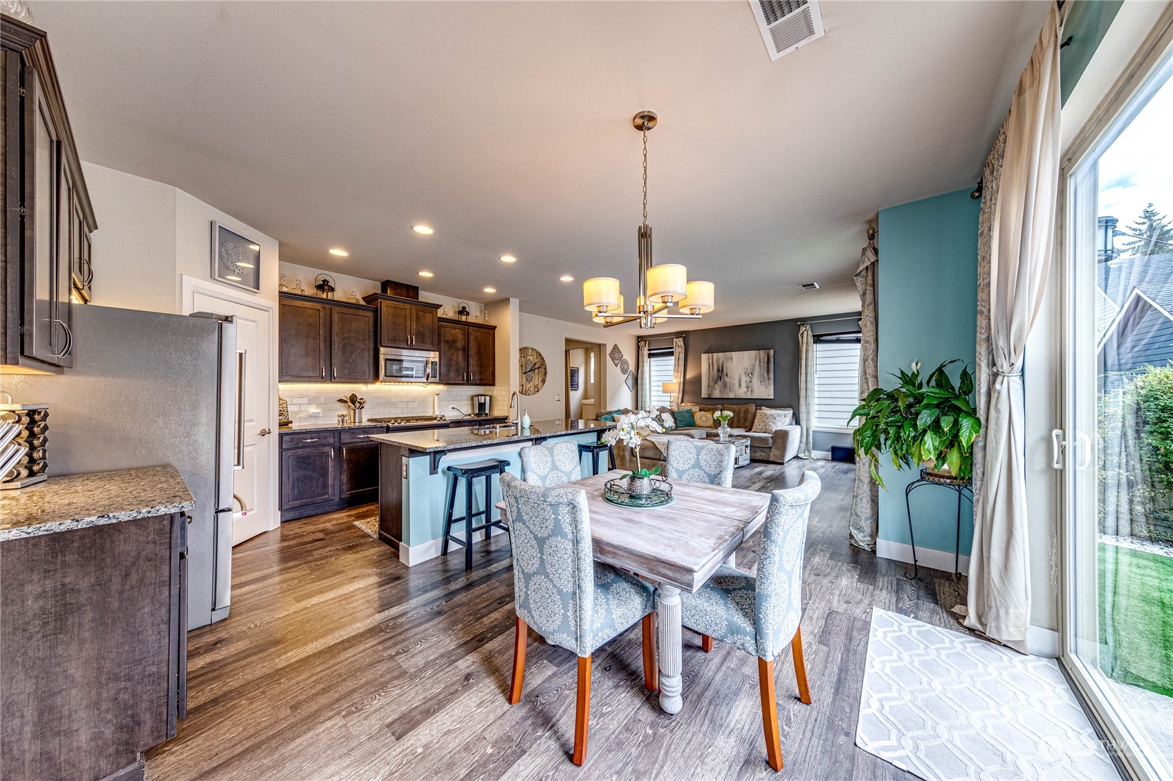 222 202nd Street Southeast Bothell, WA 98012 - Photo 13 of 37 a view of a dining room with furniture window and wooden floor