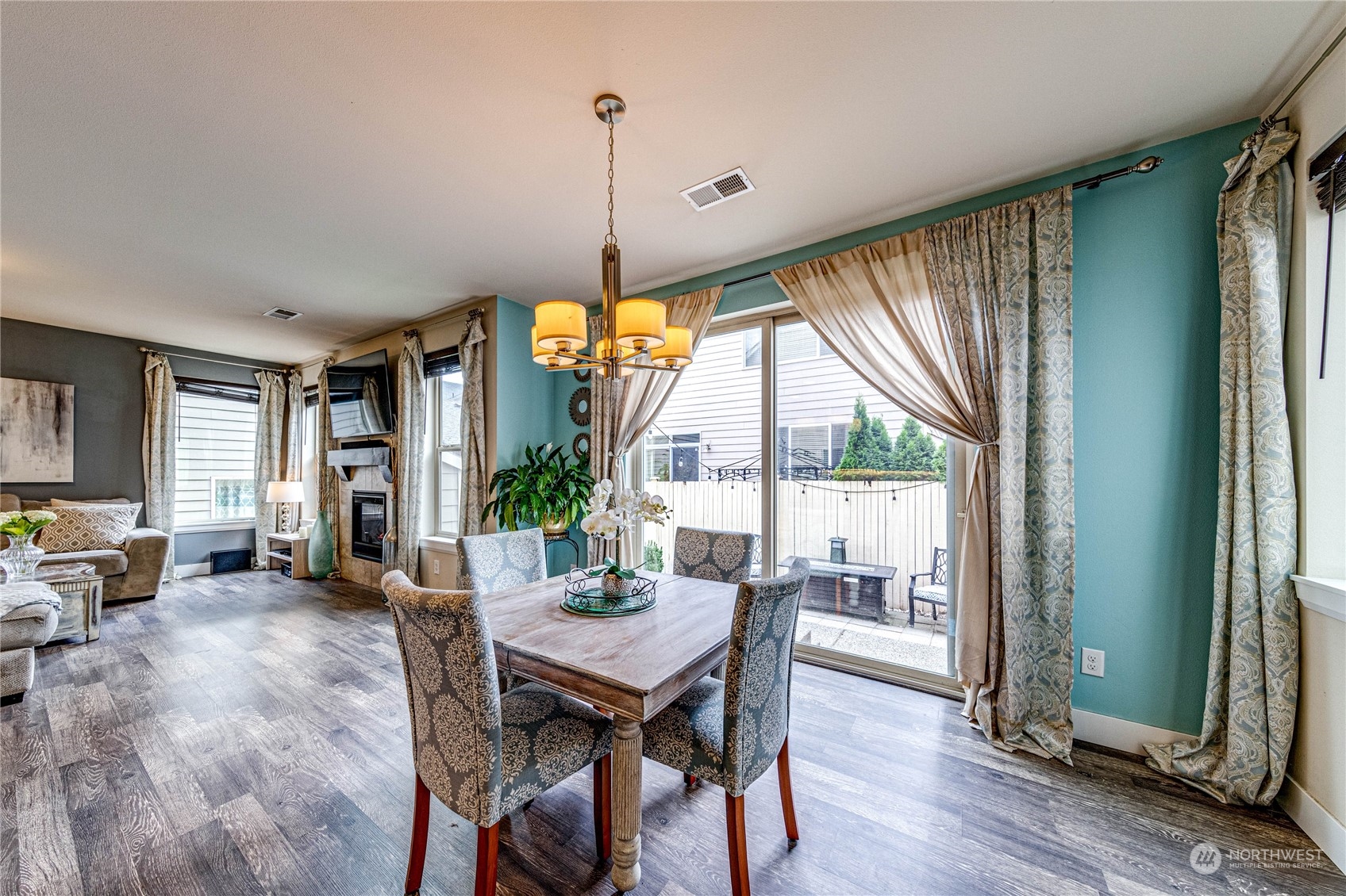 222 202nd Street Southeast Bothell, WA 98012 - Photo 14 of 37 a view of a dining room with furniture window and wooden floor