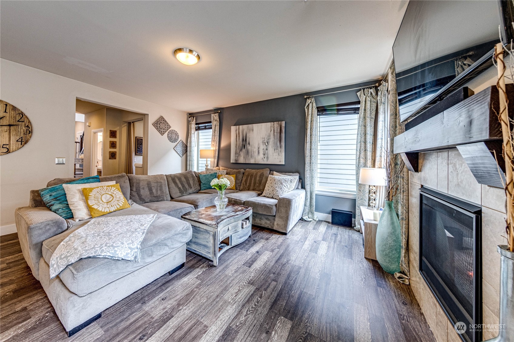 222 202nd Street Southeast Bothell, WA 98012 - Photo 16 of 37 a living room with furniture and a fireplace