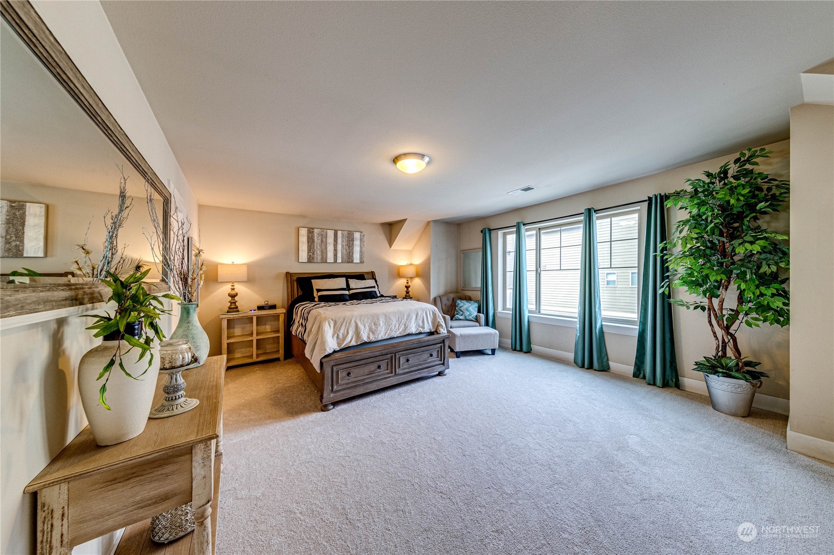 222 202nd Street Southeast Bothell, WA 98012 - Photo 20 of 37 a spacious bedroom with a bed and large windows