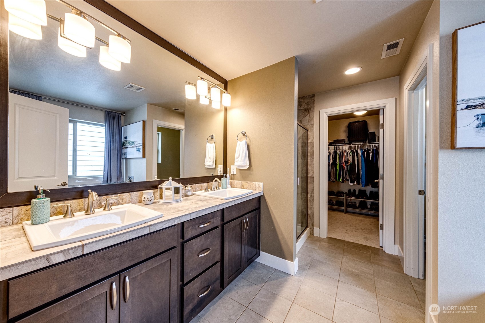 222 202nd Street Southeast Bothell, WA 98012 - Photo 22 of 37 a bathroom with a double vanity sink and a mirror