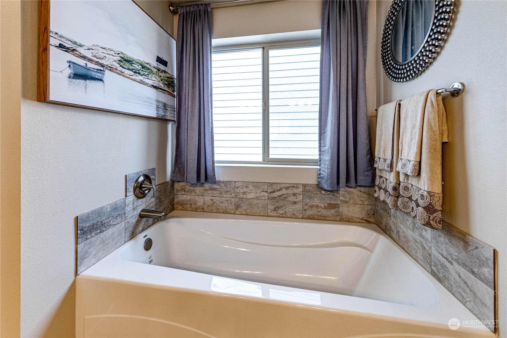 222 202nd Street Southeast Bothell, WA 98012 - Photo 24 of 37 a bathroom with a bathtub and a window