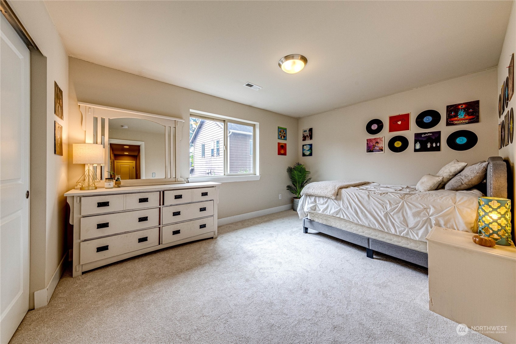 222 202nd Street Southeast Bothell, WA 98012 - Photo 26 of 37 a bedroom with a bed and a dresser in it