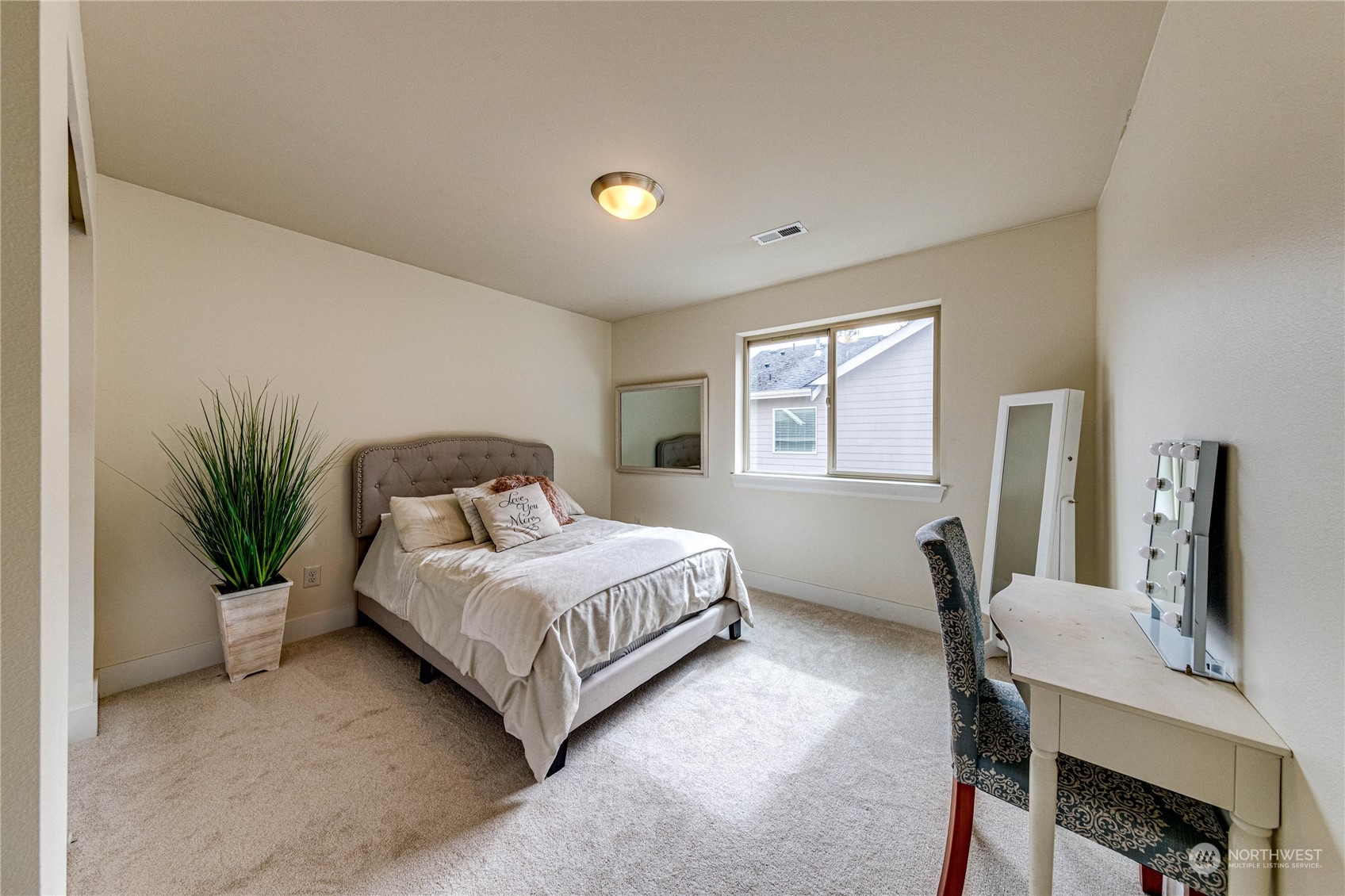 222 202nd Street Southeast Bothell, WA 98012 - Photo 27 of 37 a living room with a bed furniture and a window