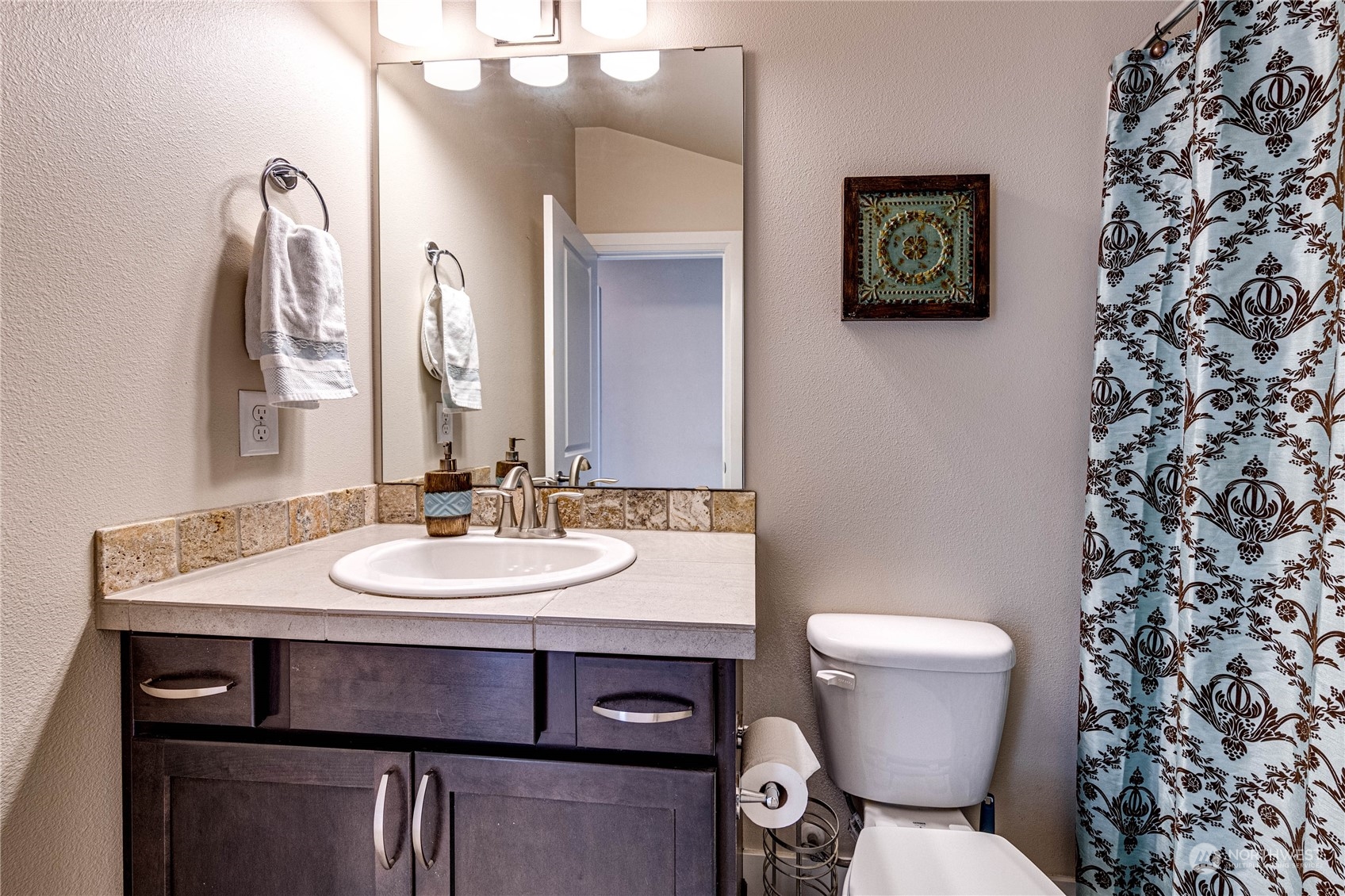 222 202nd Street Southeast Bothell, WA 98012 - Photo 30 of 37 a bathroom with a toilet sink and mirror