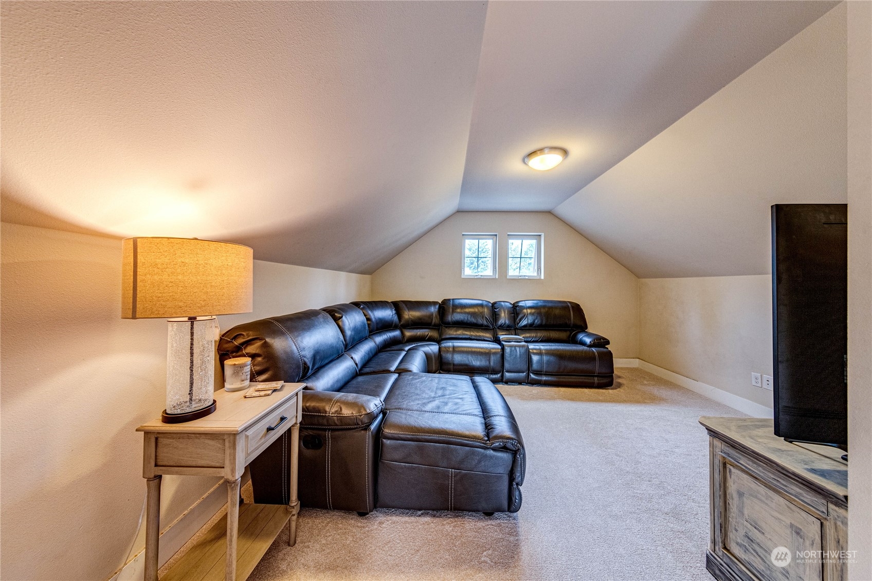 222 202nd Street Southeast Bothell, WA 98012 - Photo 31 of 37 a living room with furniture and a flat screen tv