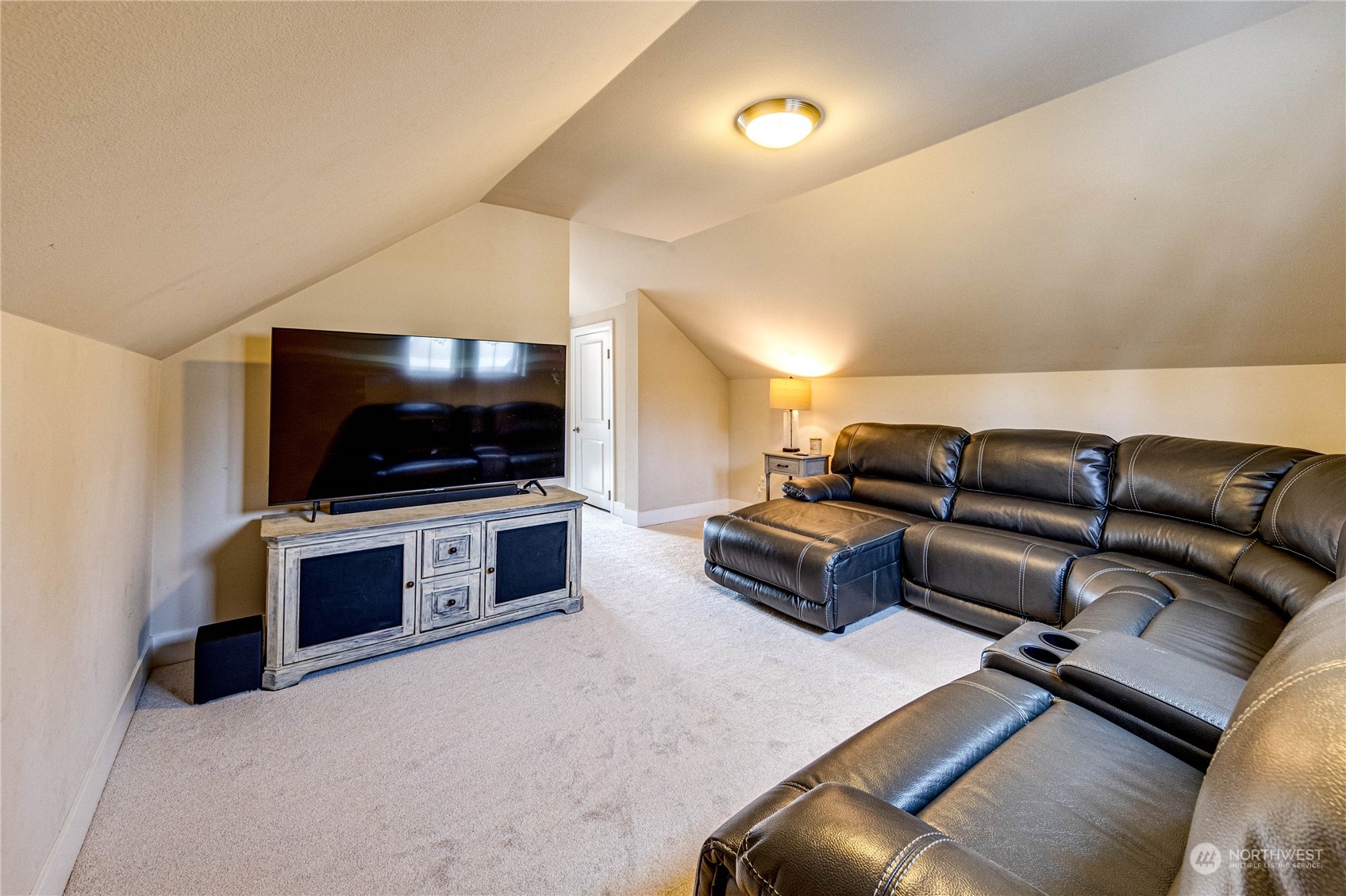 222 202nd Street Southeast Bothell, WA 98012 - Photo 32 of 37 a living room with furniture and a flat screen tv