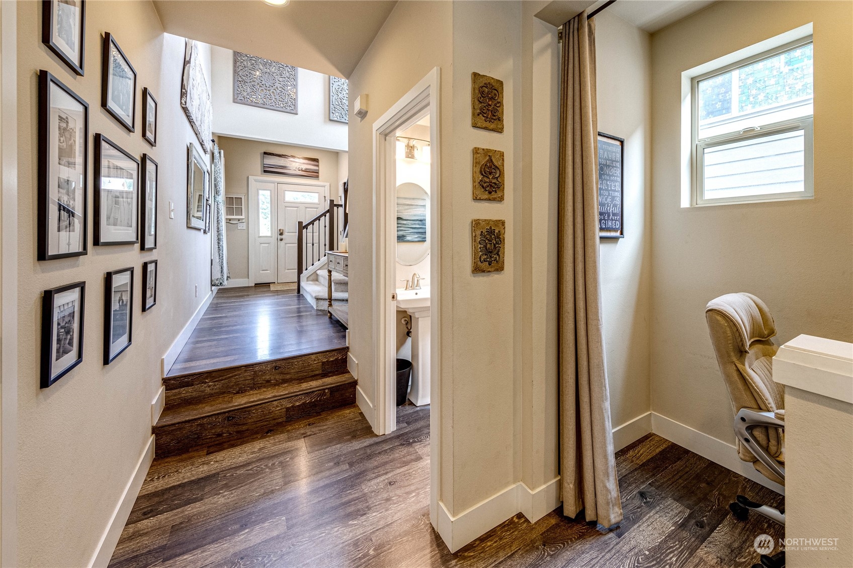 222 202nd Street Southeast Bothell, WA 98012 - Photo 5 of 37 a room with wooden floor and furniture