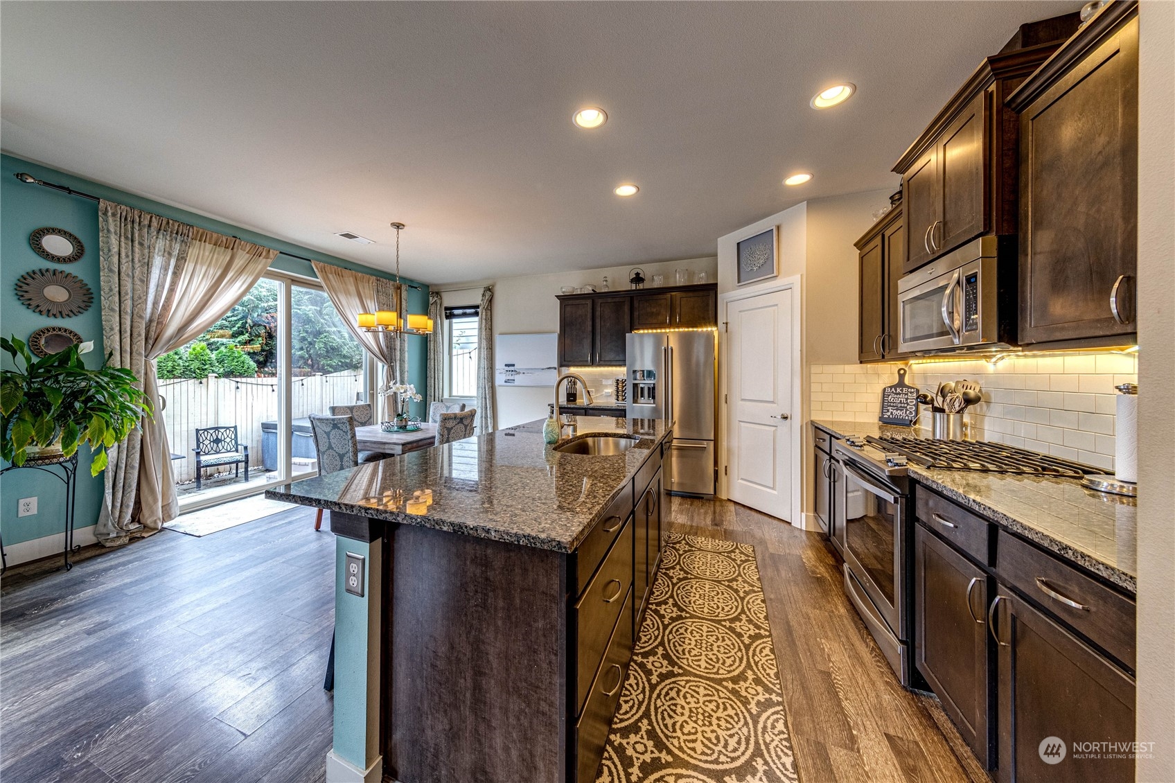 222 202nd Street Southeast Bothell, WA 98012 - Photo 7 of 37 a kitchen with stainless steel appliances granite countertop sink stove top oven and cabinets