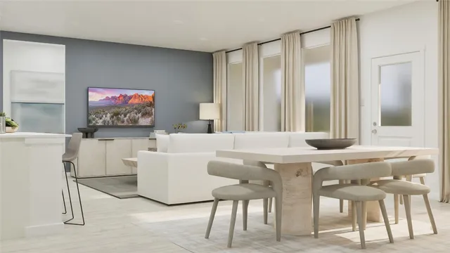 a living room with furniture a window and a flat screen tv