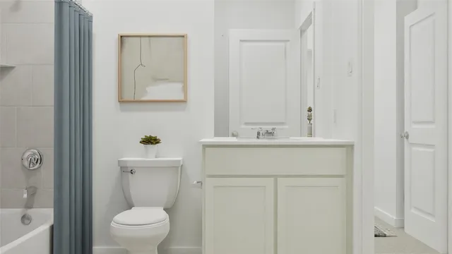 a bathroom with a sink toilet and vanity