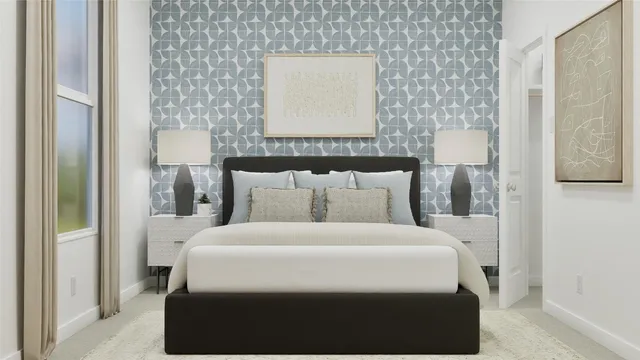 a bedroom with a bed and a night stand